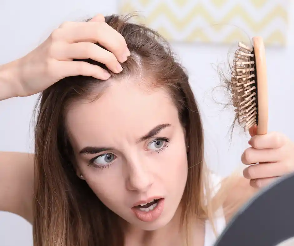 girl hair loss on brush