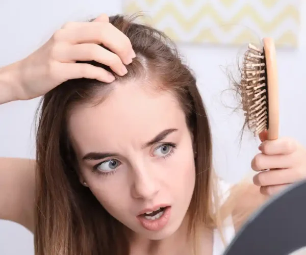 girl hair loss on brush